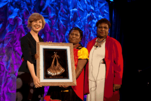 Jane Sloane presents the Women's Funding Network 2012 LEAD Award to Janet Snape.