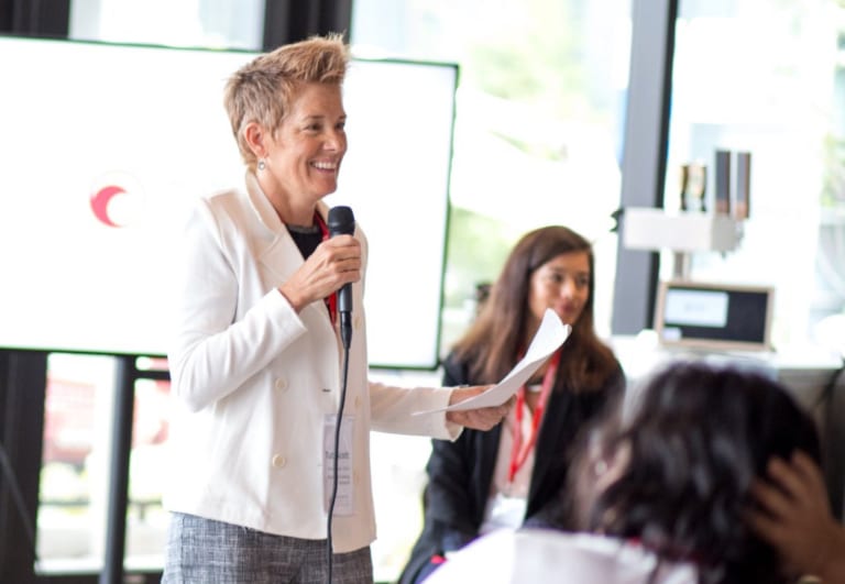 Woman with microphone making presentation