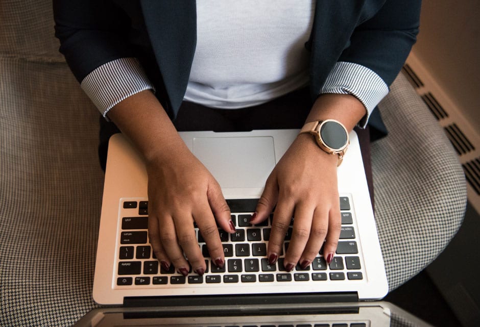 Woman typing on laptop